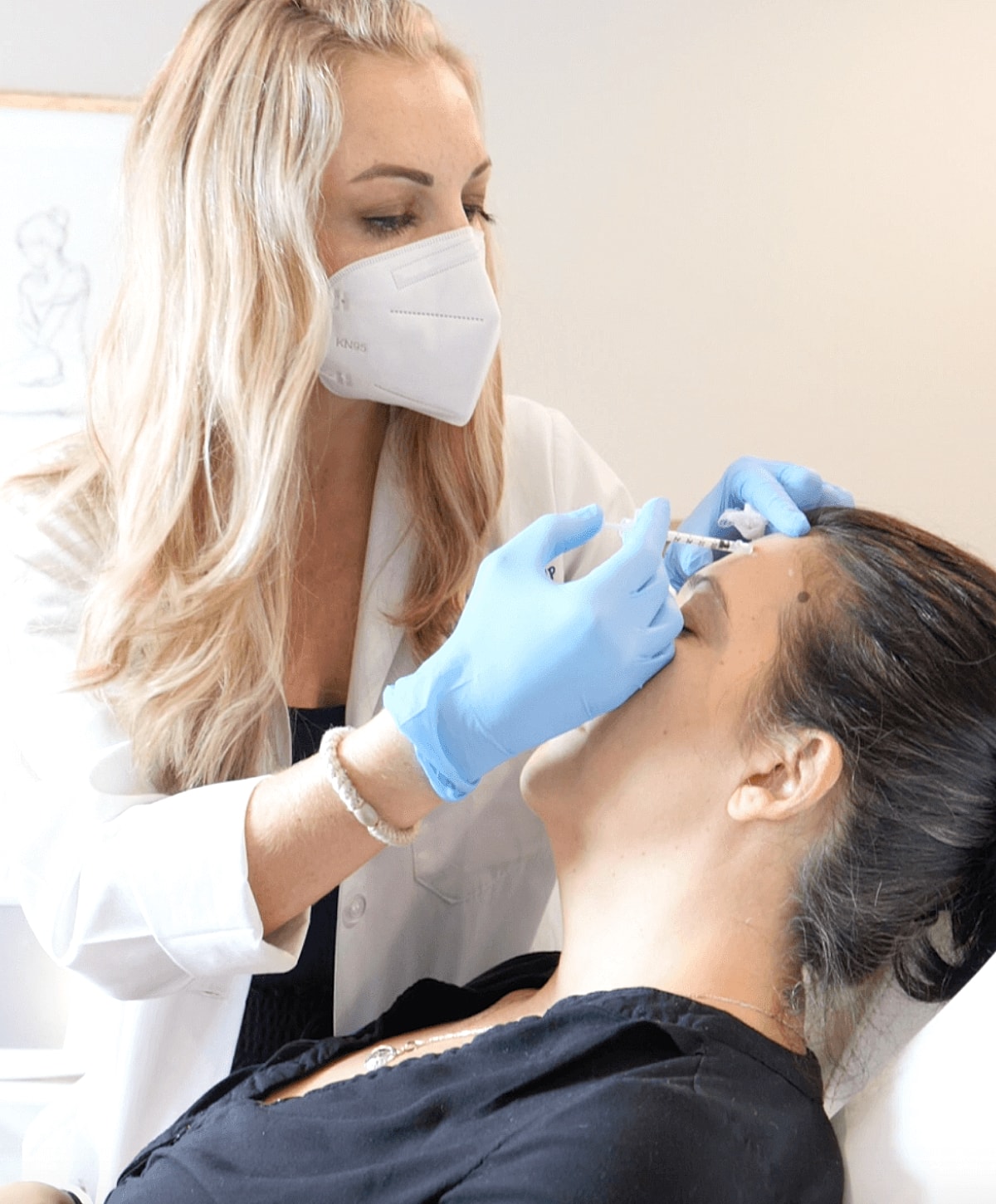 Practitioner administering treatment to a client.