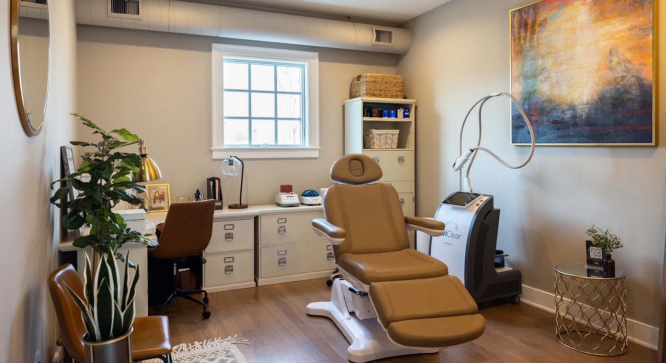 Modern treatment room with comfortable chair and decor.