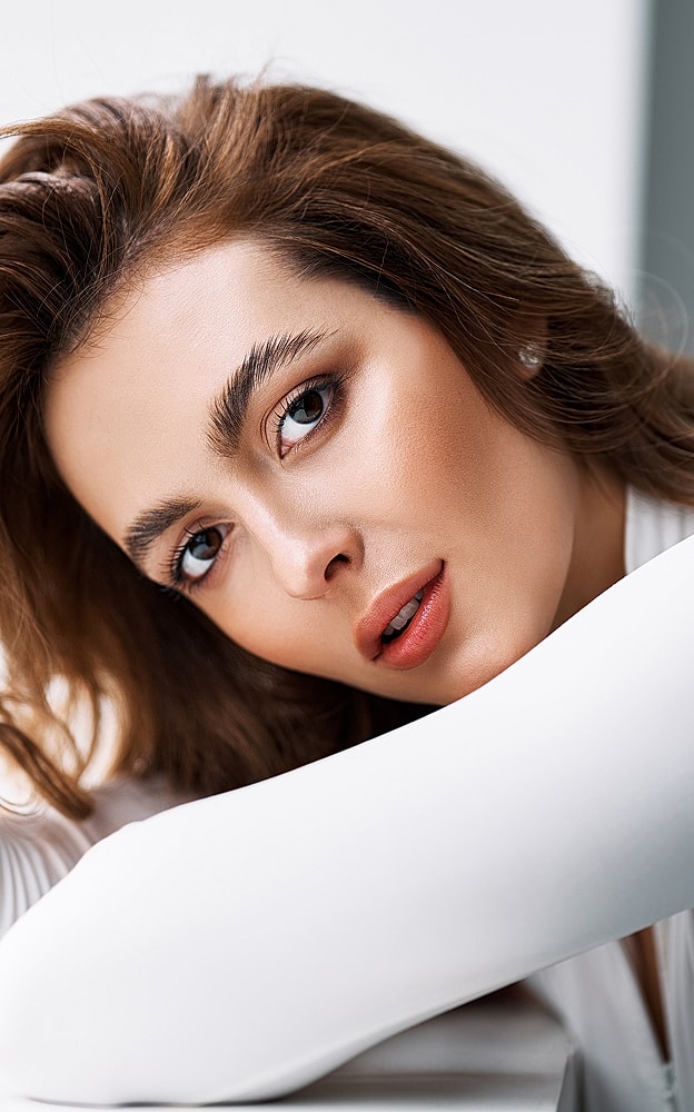 Close-up portrait of a woman with stylish hair.